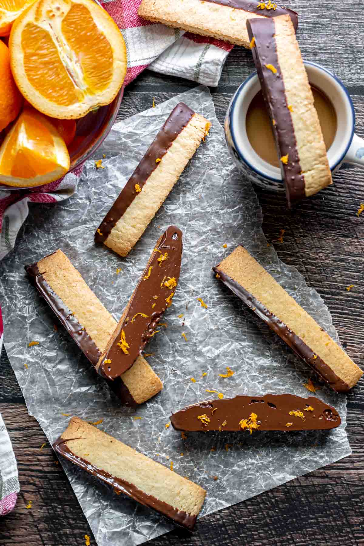 Dark Chocolate Orange Biscotti scattered on counter