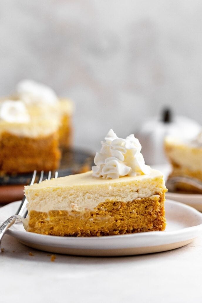 Double layer pumpkin cheesecake slice on a plate