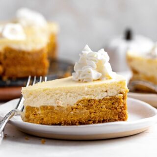 Double layer pumpkin cheesecake slice on a plate
