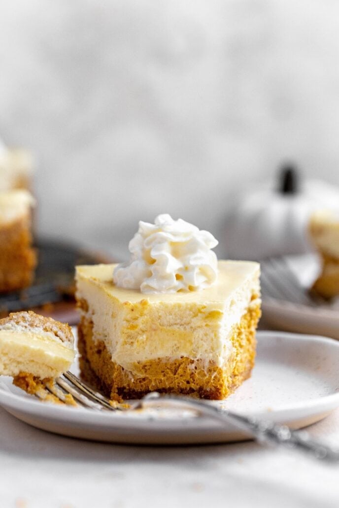 Double layer pumpkin cheesecake slice on a plate