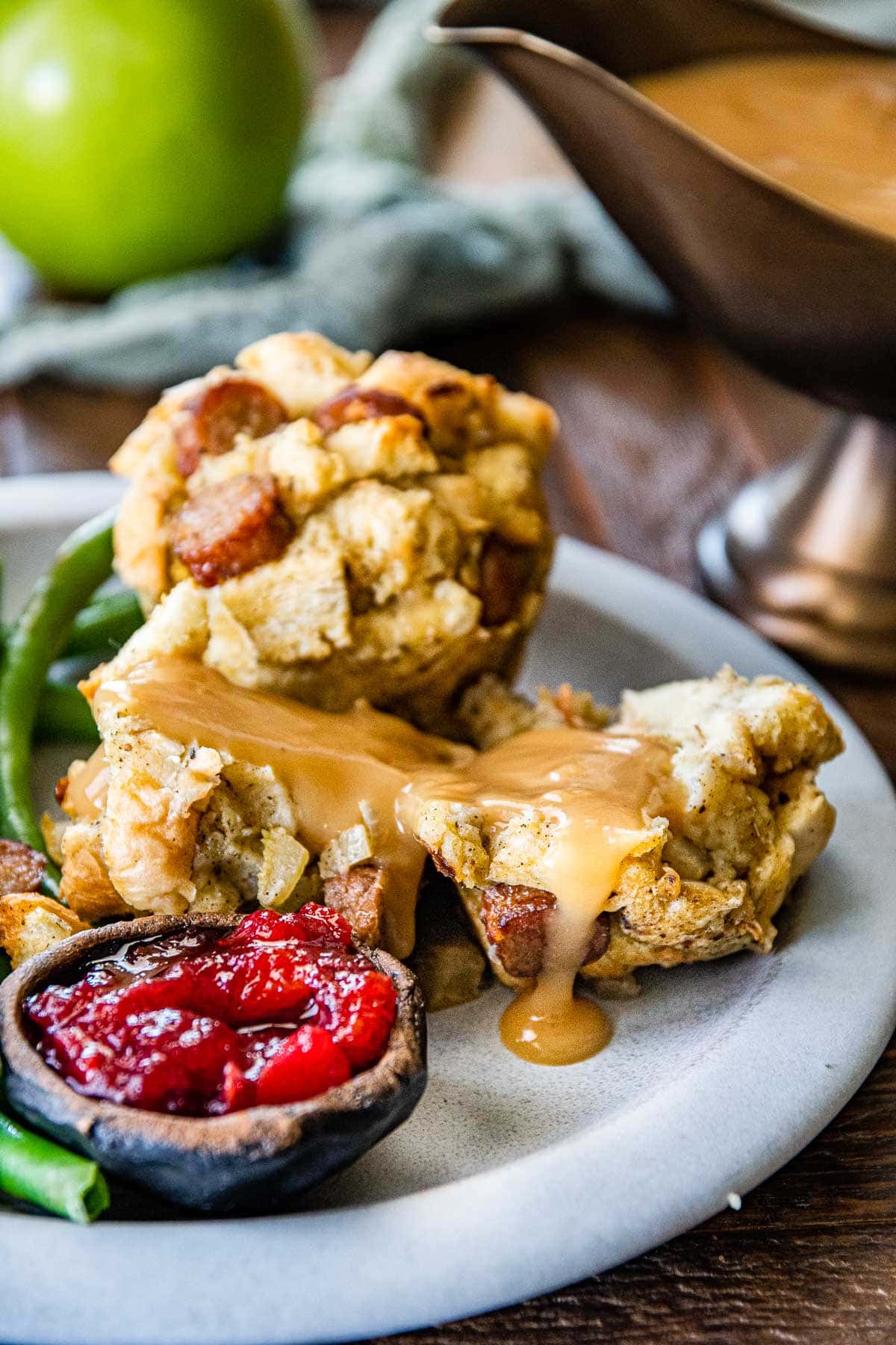 Easy Stuffing Muffins on serving plate showing interior with gravy