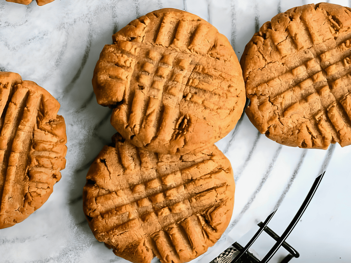 nutty cookies on a cooling rack with criss crosses on them