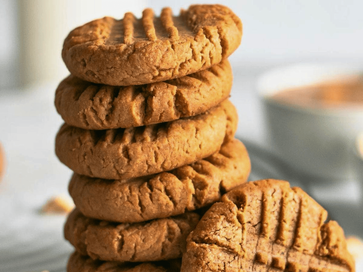 nutty cookies stacked on one another with one leaning on the side