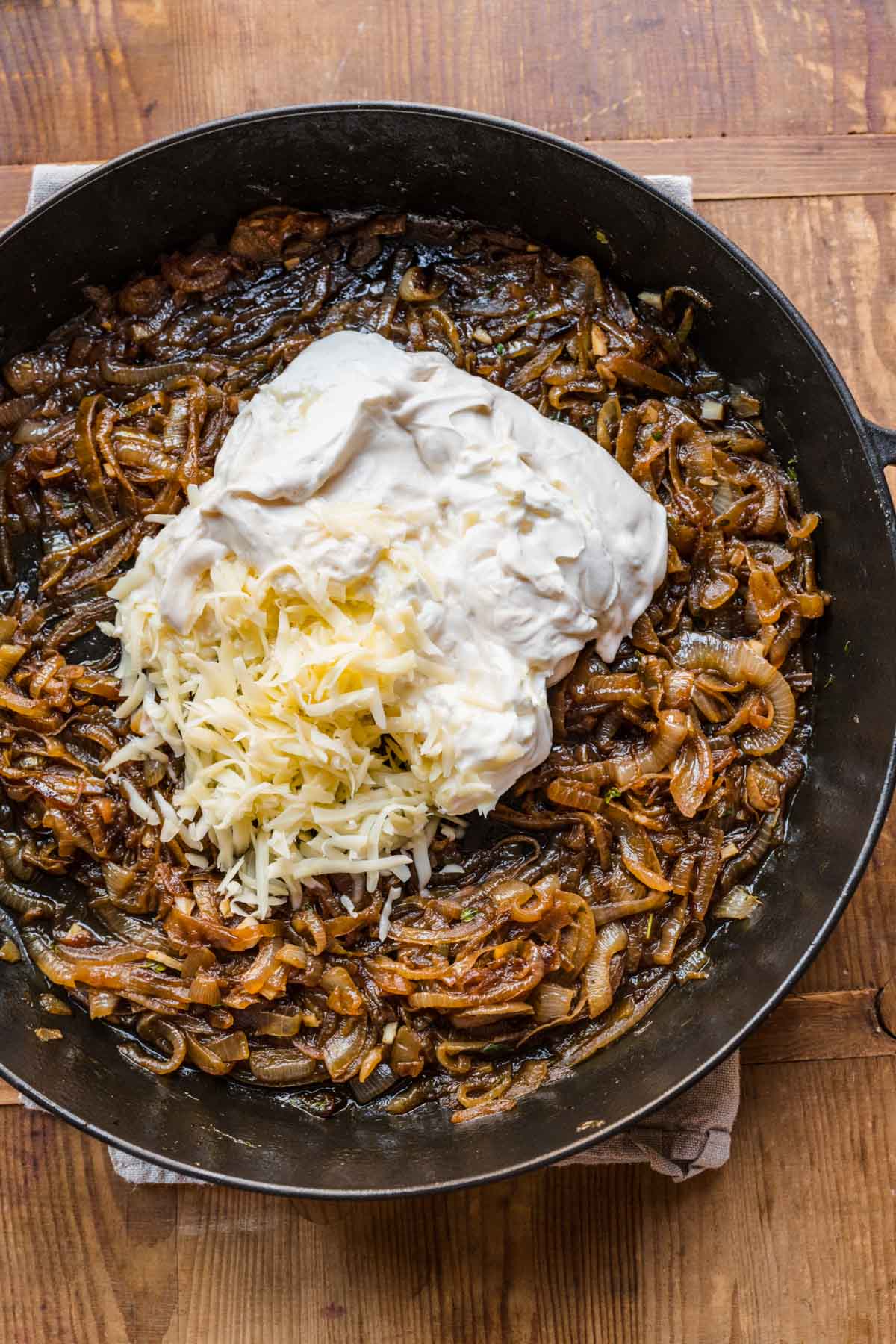 French Onion Soup Dip ingredients in cooking pan