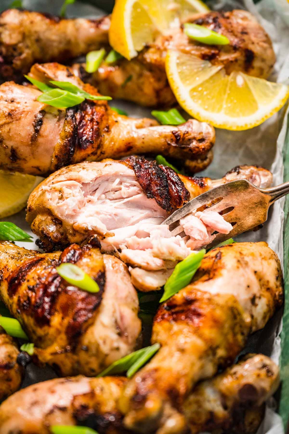 Grilled Drumsticks with garnish in serving dish