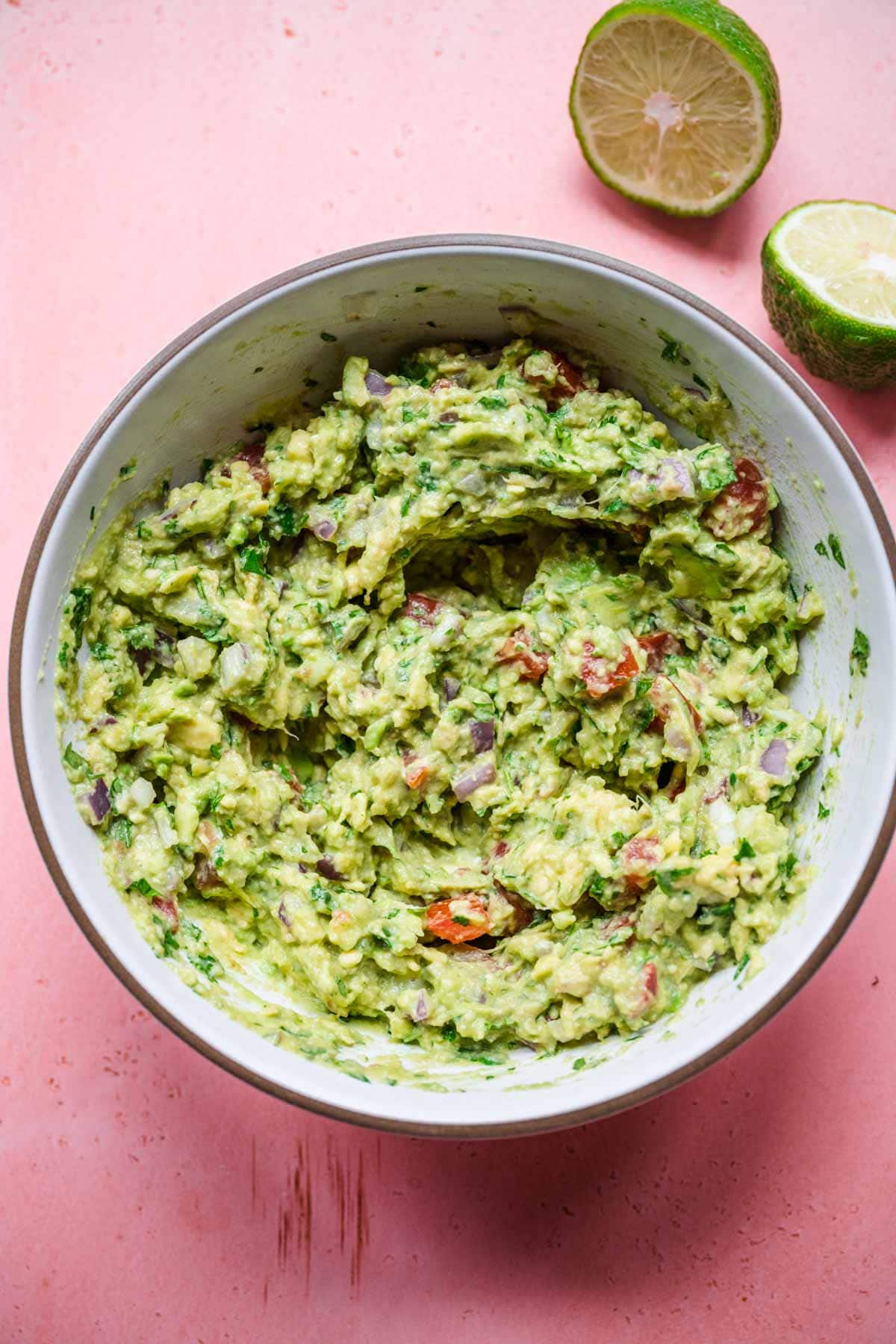 Easy Guacamole ingredients in mixing bowl