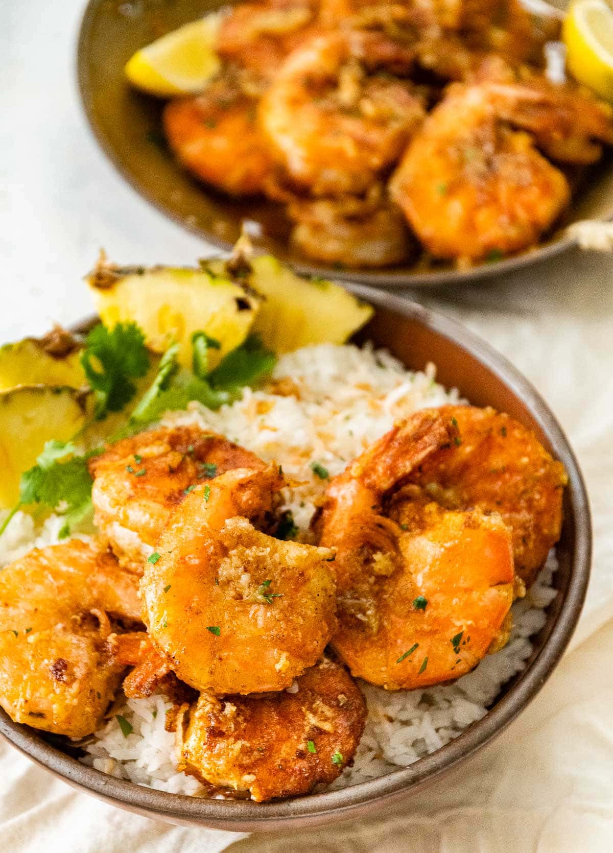 Hawaiian Garlic Shrimp on serving plate over rice