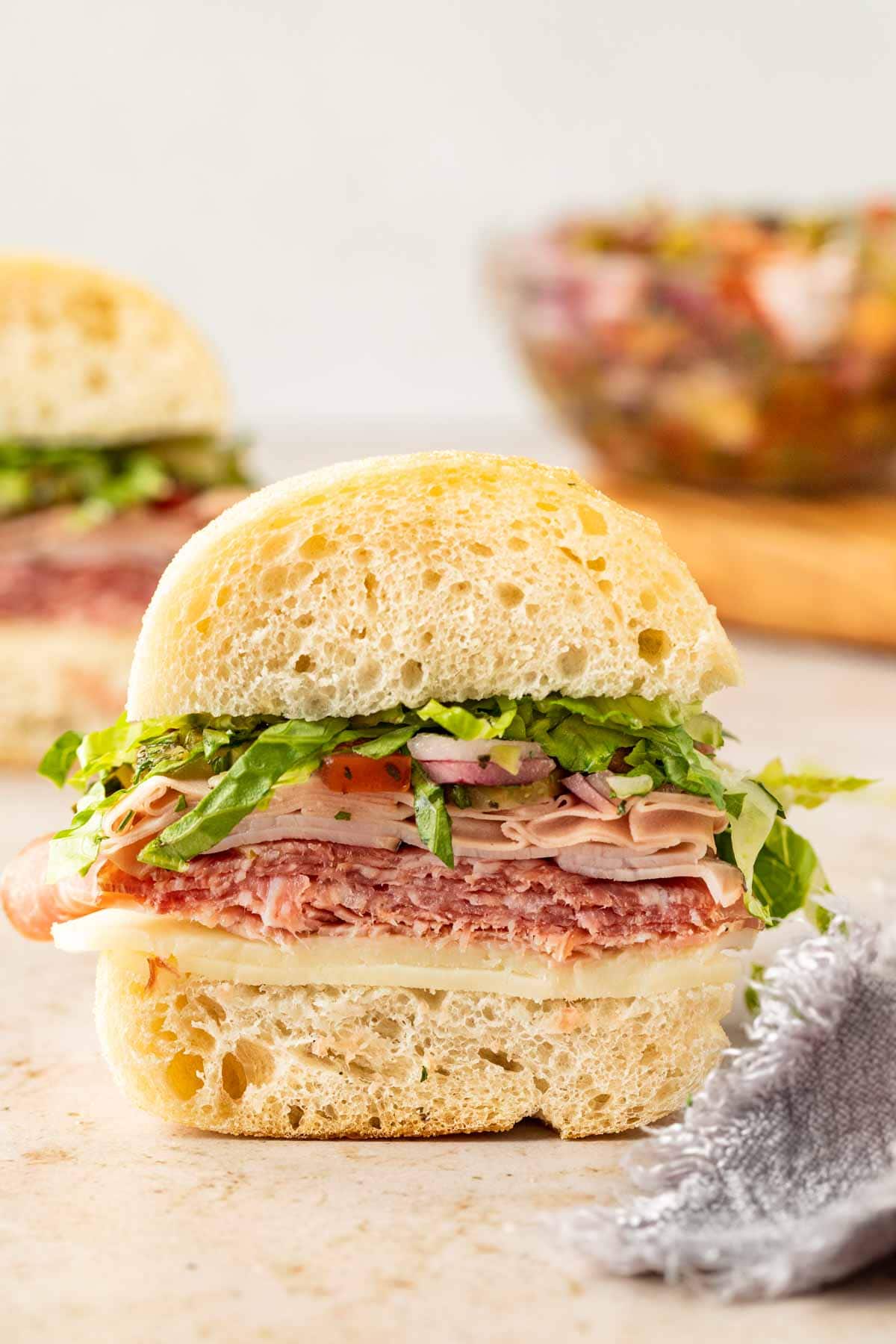 Italian Sub Sandwich cut in half on countertop