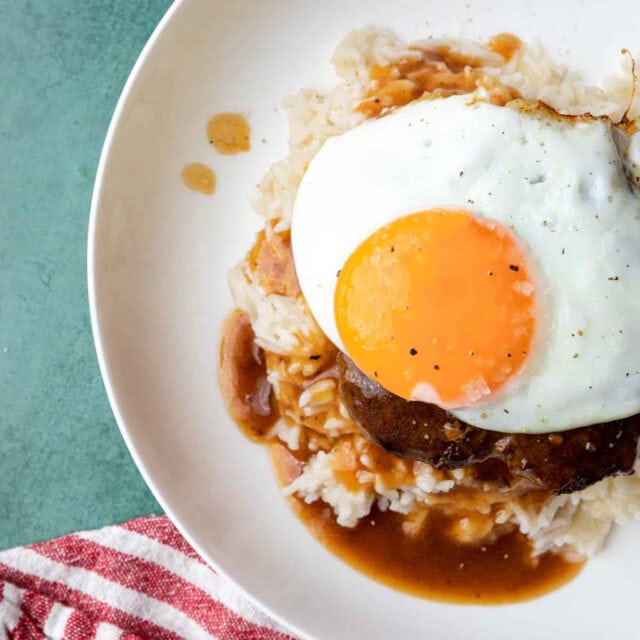 Loco Moco assembled dish with rice, patty, egg, and gravy on plate