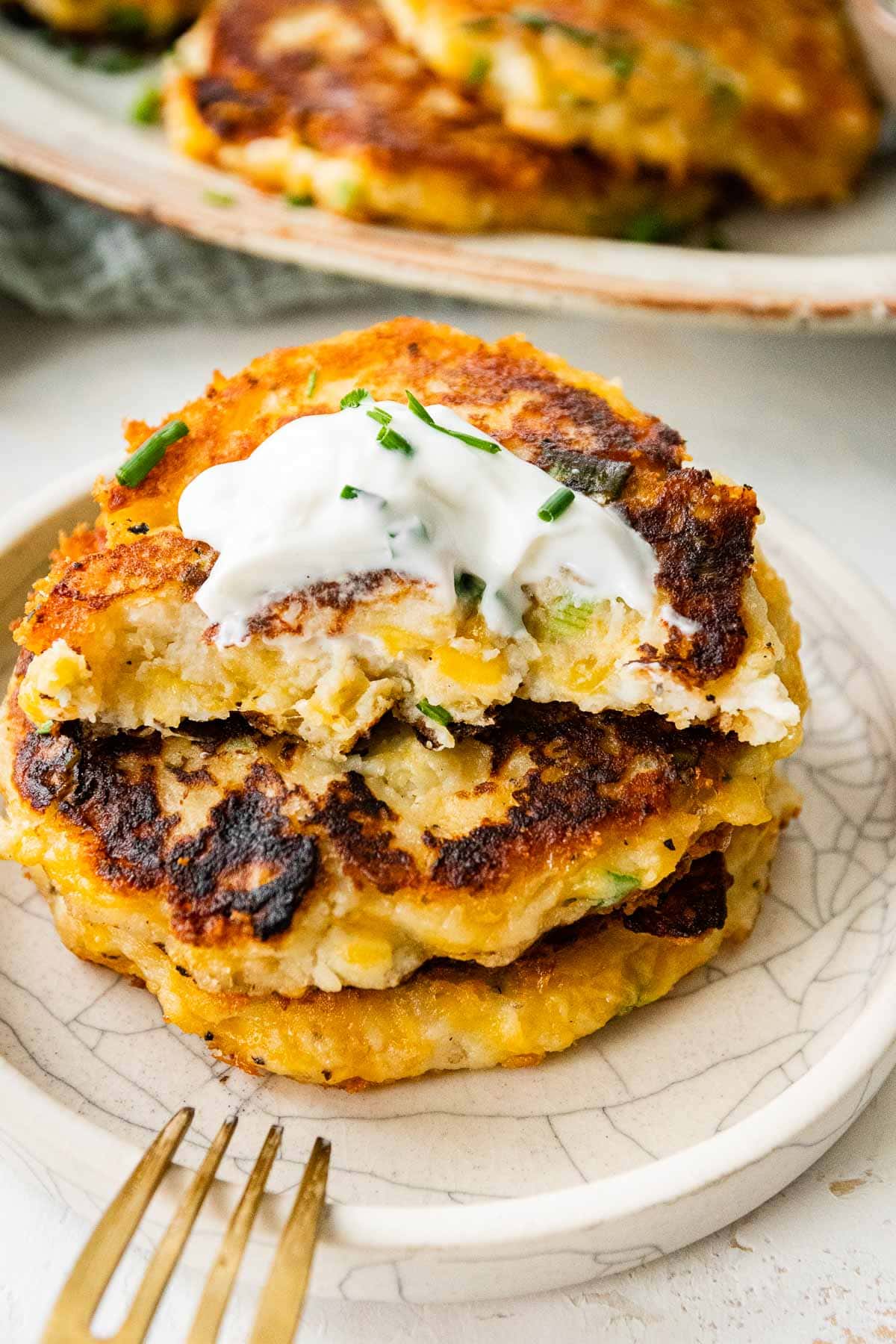 Mashed Potato Pancakes stack on serving plate showing interior