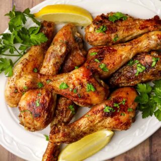 Drumsticks on a white serving platter