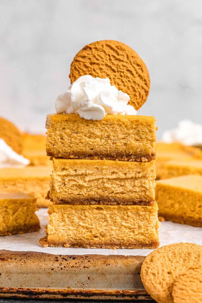 Pumpkin Cheesecake Bars sliced in a stack