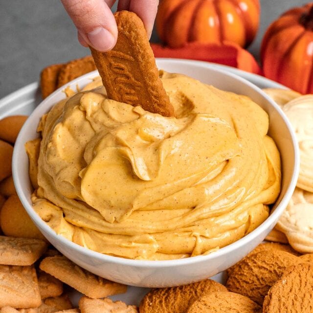 Pumpkin Fluff Dip in serving bowl with cookie dipping 1x1