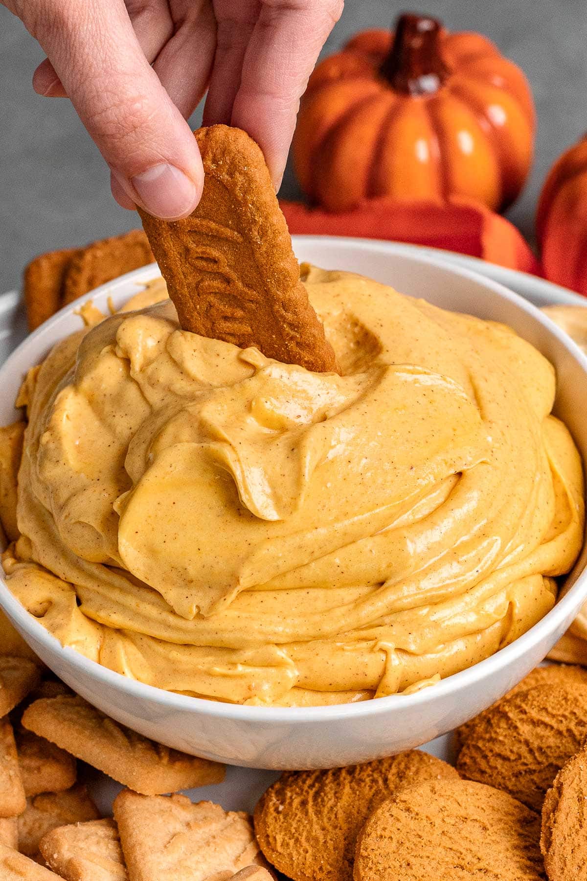 Pumpkin Fluff Dip in serving bowl with cookie dipping