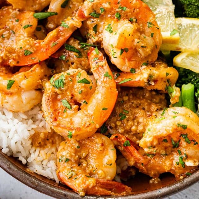 Close up of shrimp with rice and broccoli in bowl.