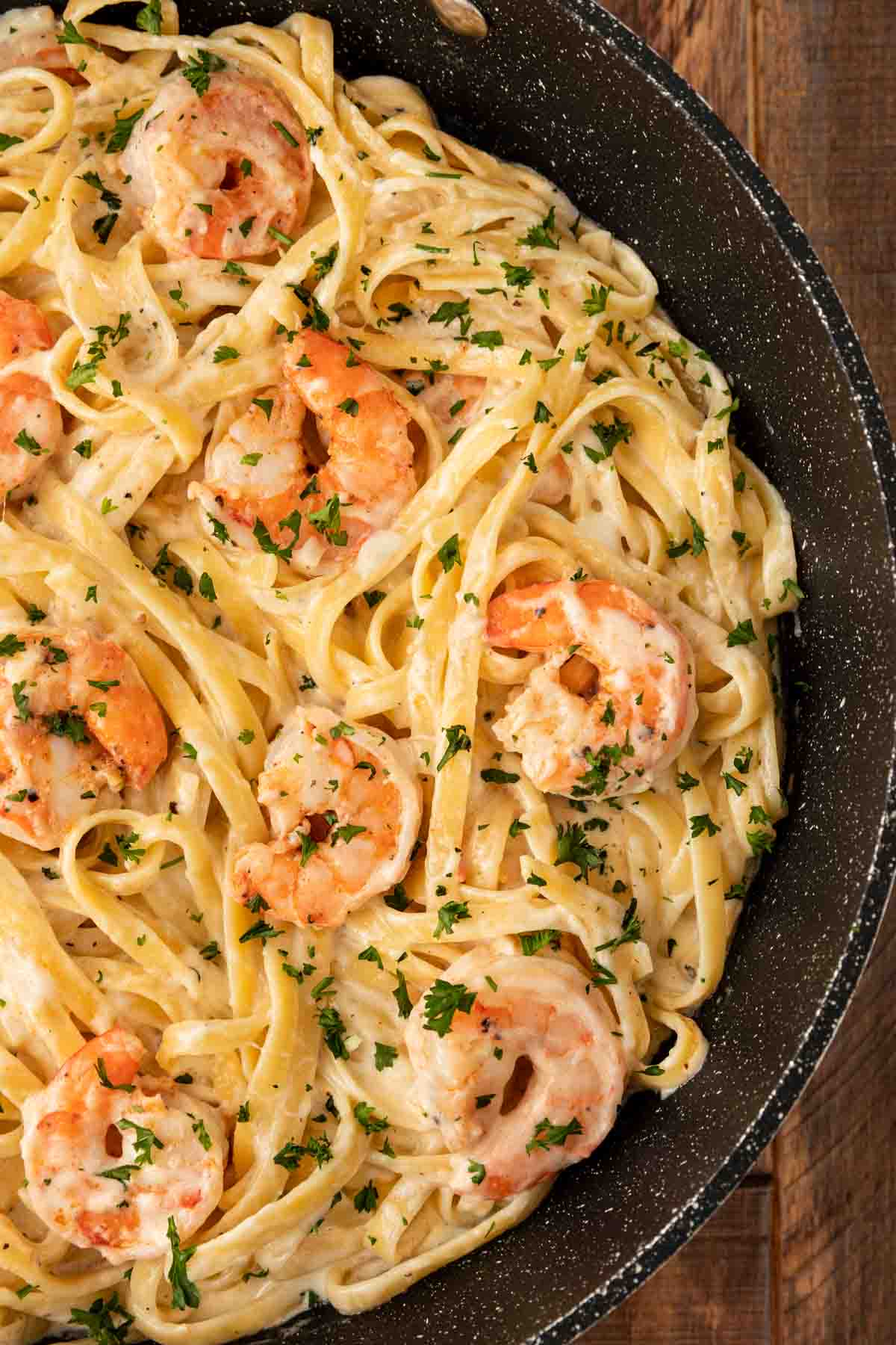 Classic Shrimp Alfredo in cooking pan closeup