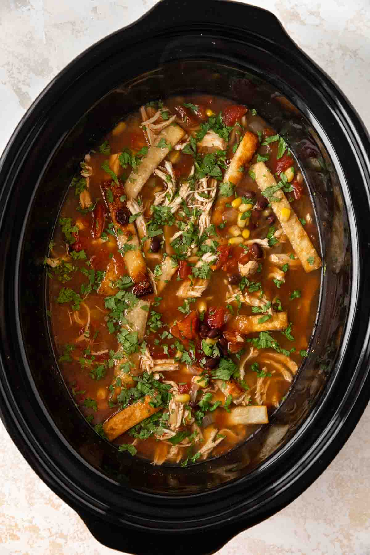 Slow Cooker Chicken Tortilla Soup ingredients in slow cooker uncooked