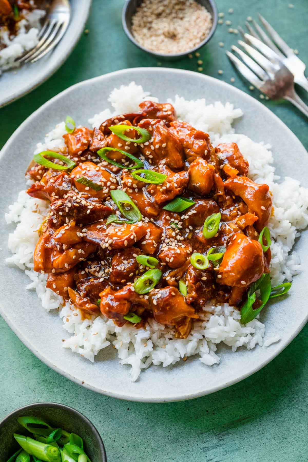 Slow Cooker Sesame Chicken on serving plate over rice