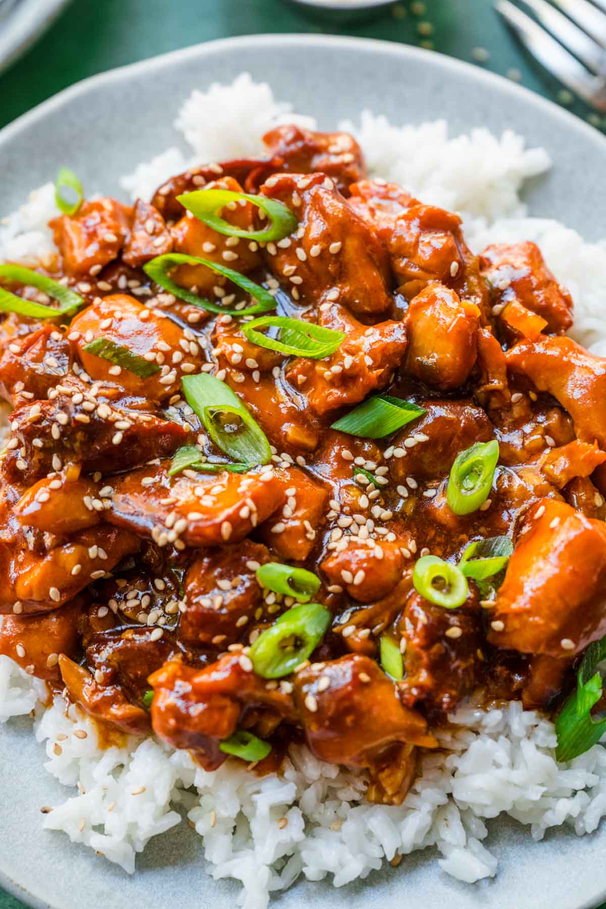 Slow Cooker Sesame Chicken on serving plate over rice