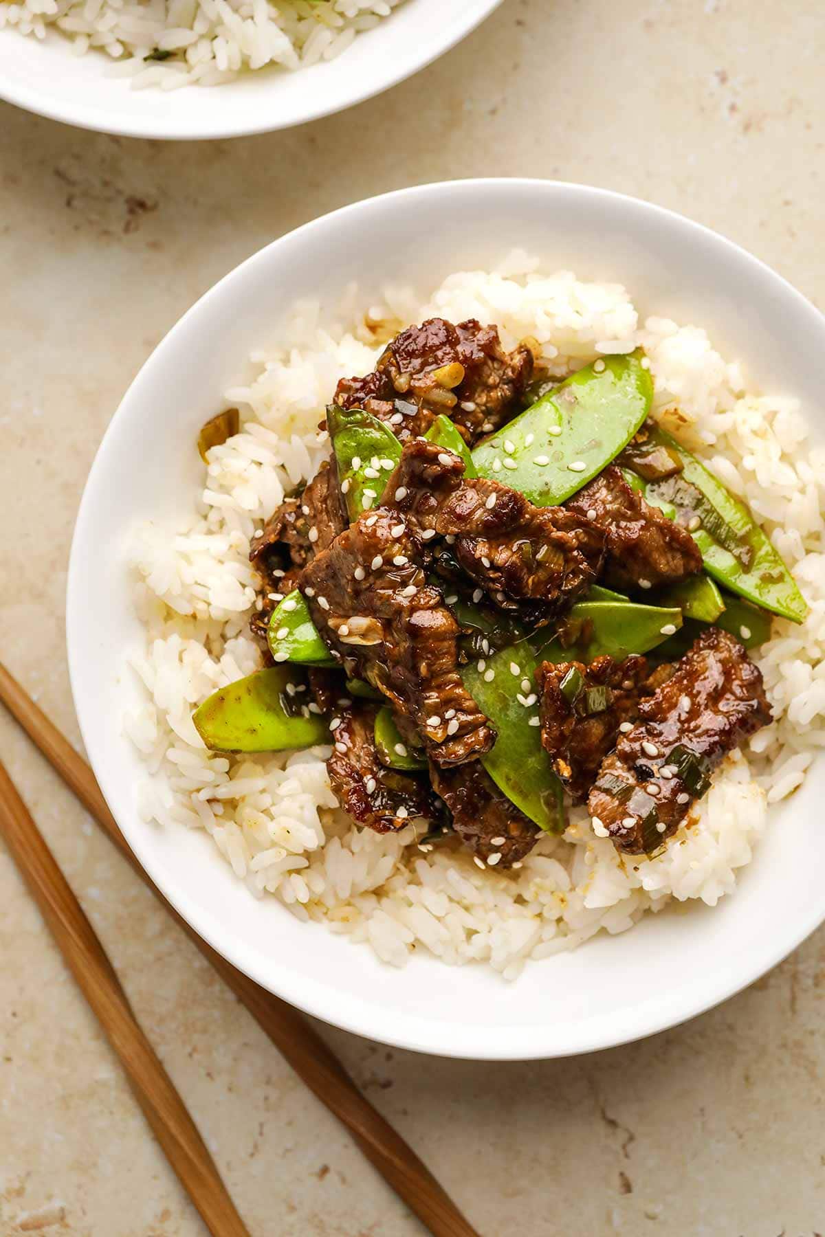 Spicy Garlic Beef Stir Fry on serving plate over rice