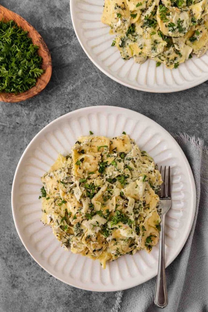 Spinach Artichoke Ravioli Bake on a plate