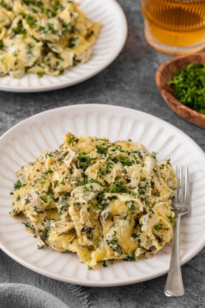 Spinach Artichoke Ravioli Bake on a plate