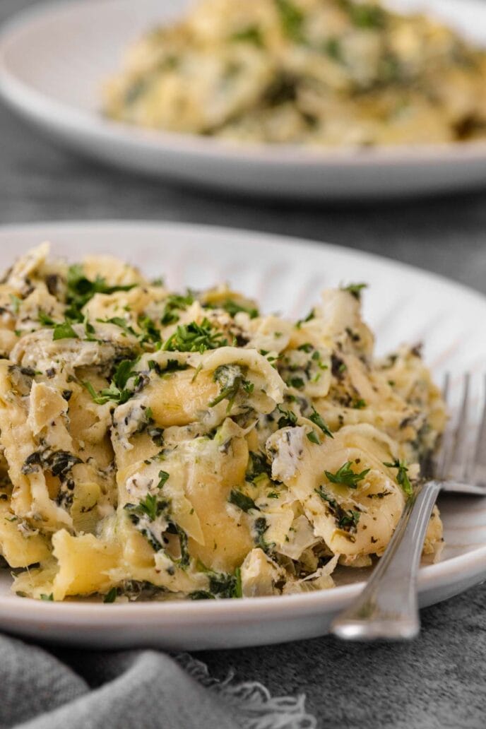 Spinach Artichoke Ravioli Bake on a plate