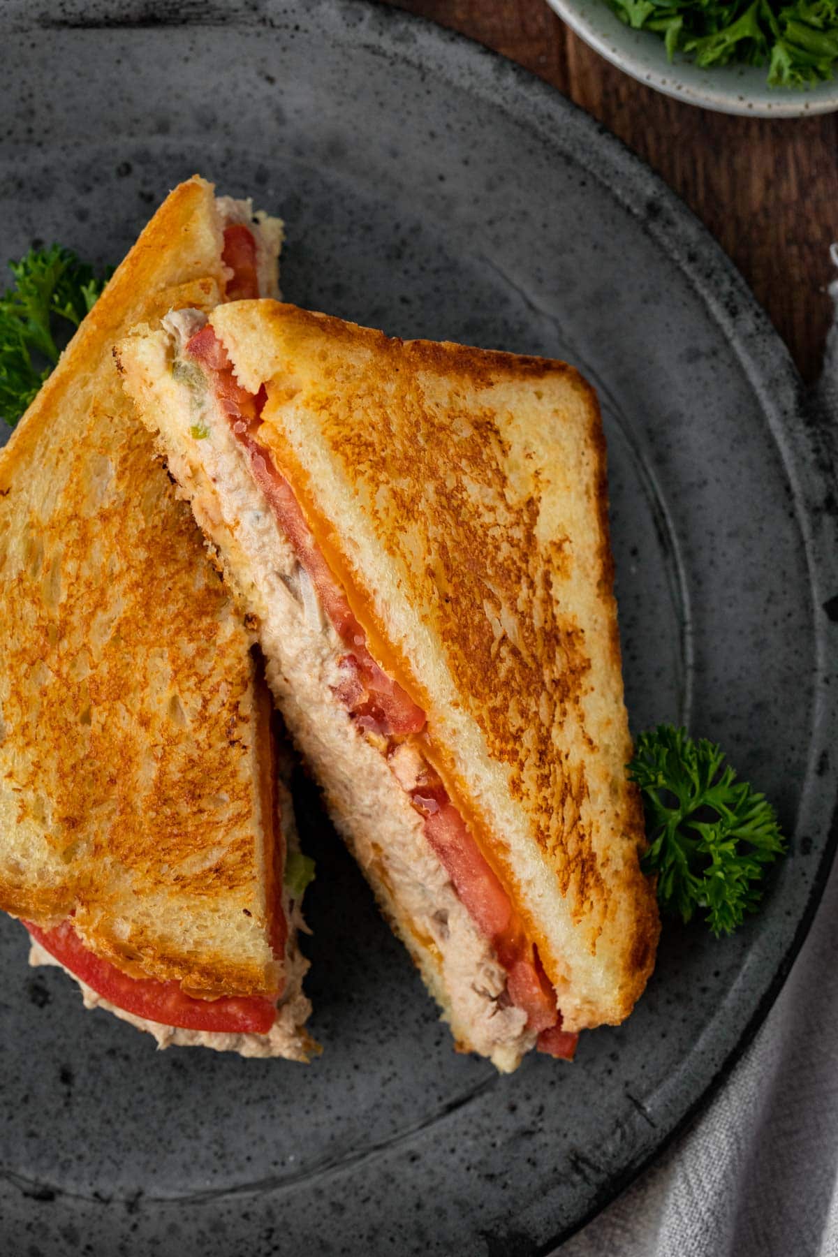 Classic Tuna Melt sandwich sliced on plate