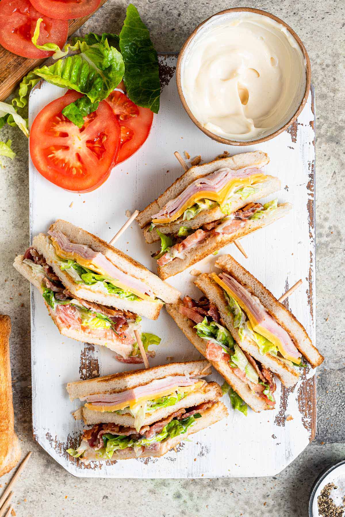 Triple Decker Club Sandwich cut on countertop