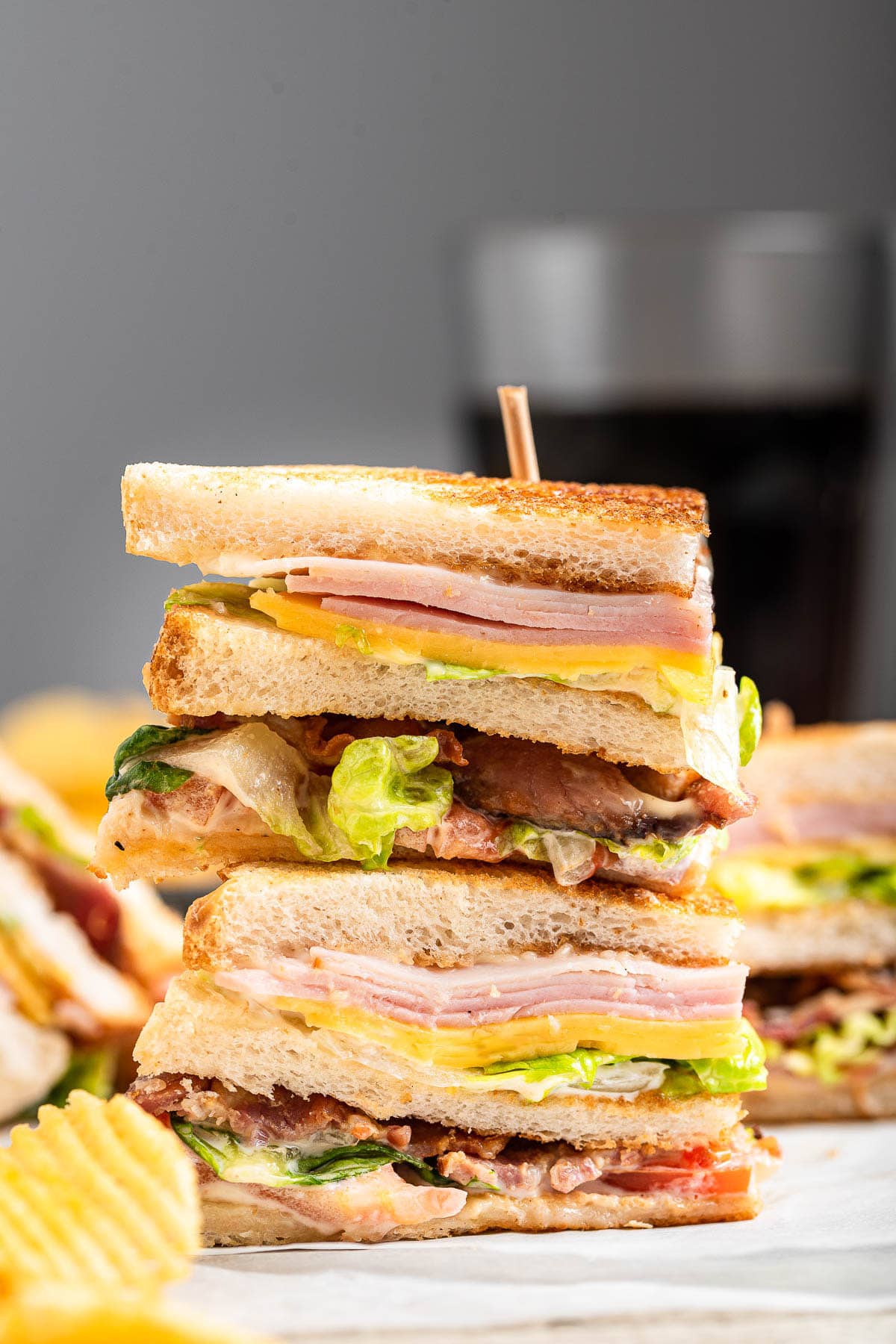 Triple Decker Club Sandwich stacked on countertop