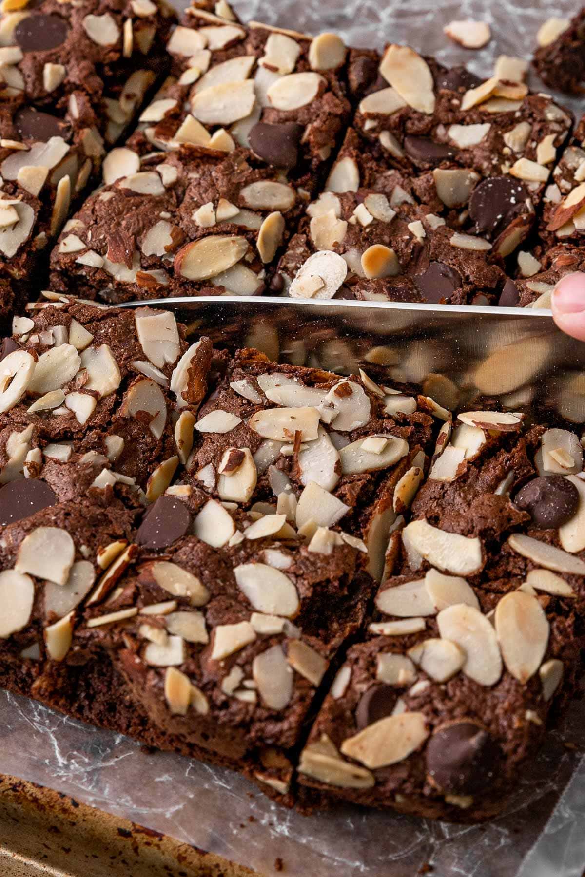 Almond Flour Chocolate Brownies slicing brownies into squares