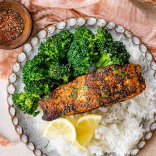 Dinner plate with fish fillet, broccoli, and rice.