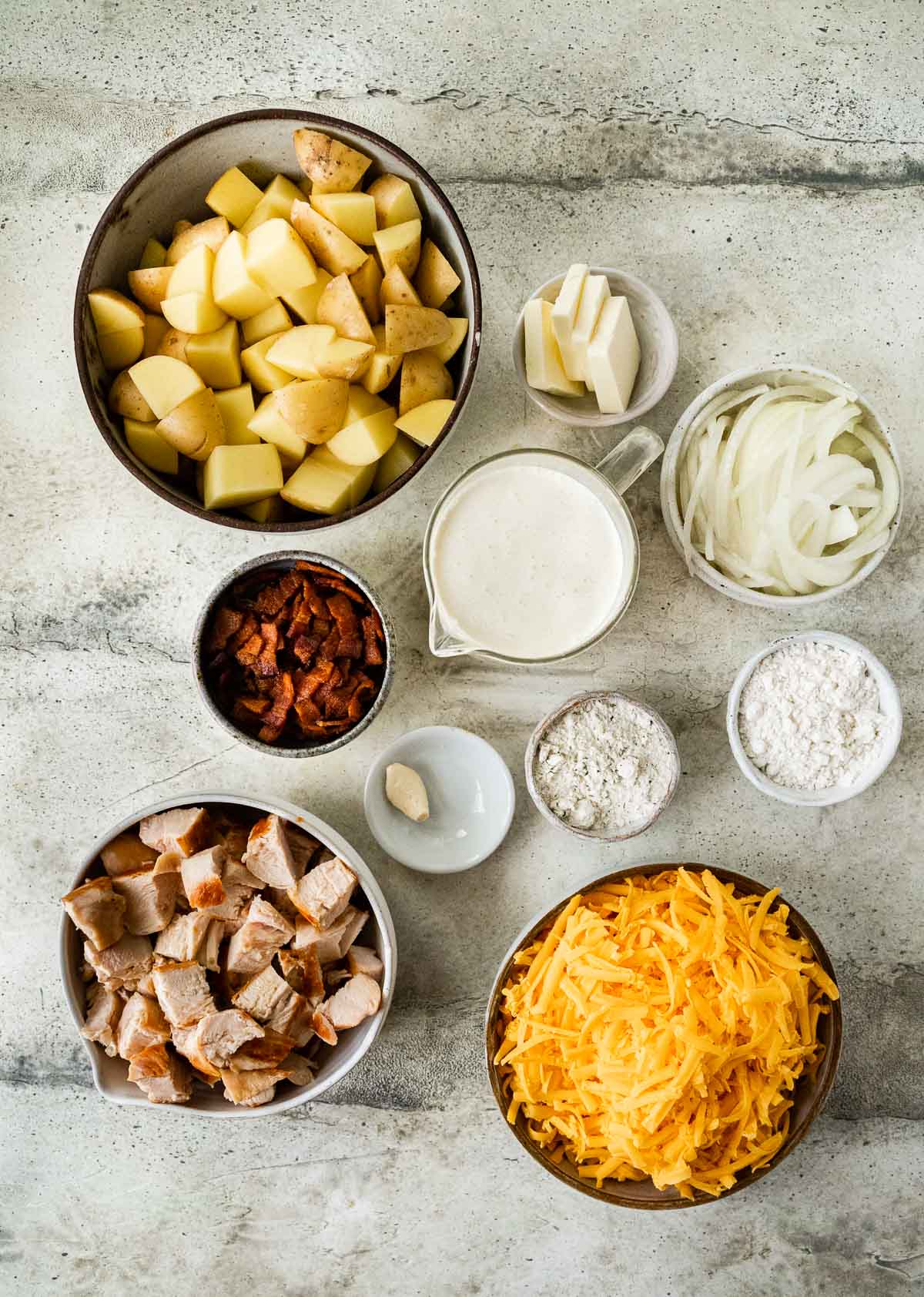 Chicken Bacon Ranch Gratin Potatoes ingredients in separate bowls