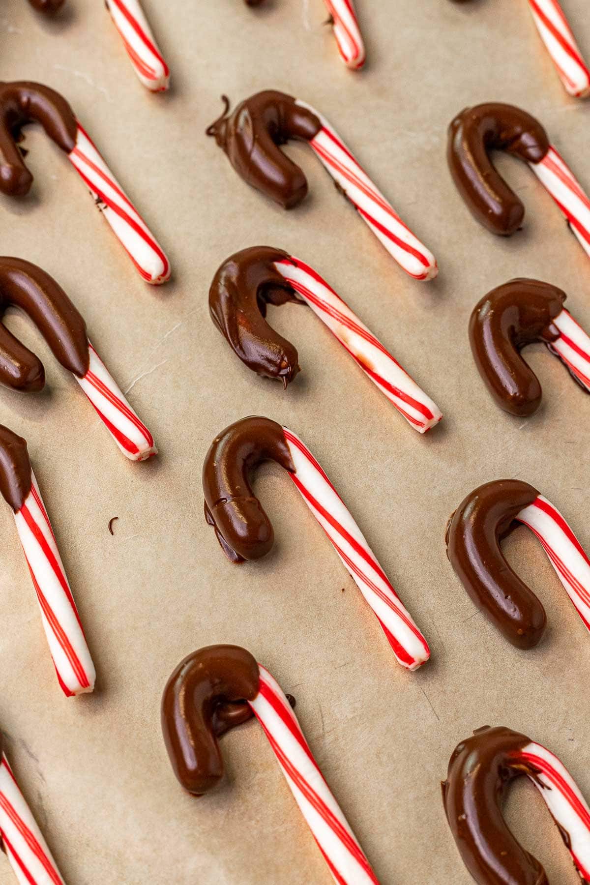 Chocolate Dipped Candy Canes dipped candy canes on cookie sheet
