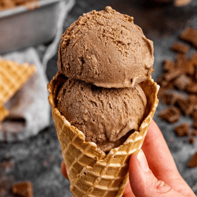 2 scoops of ice cream in a waffle cone