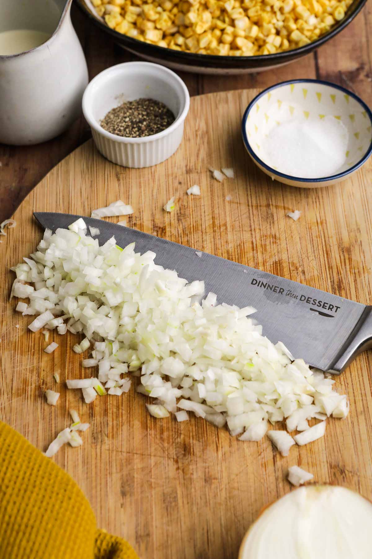 Creamed Corn chopped onion on cutting board