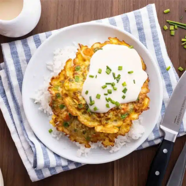 Cooked ingredients on a bed of rice ready to eat