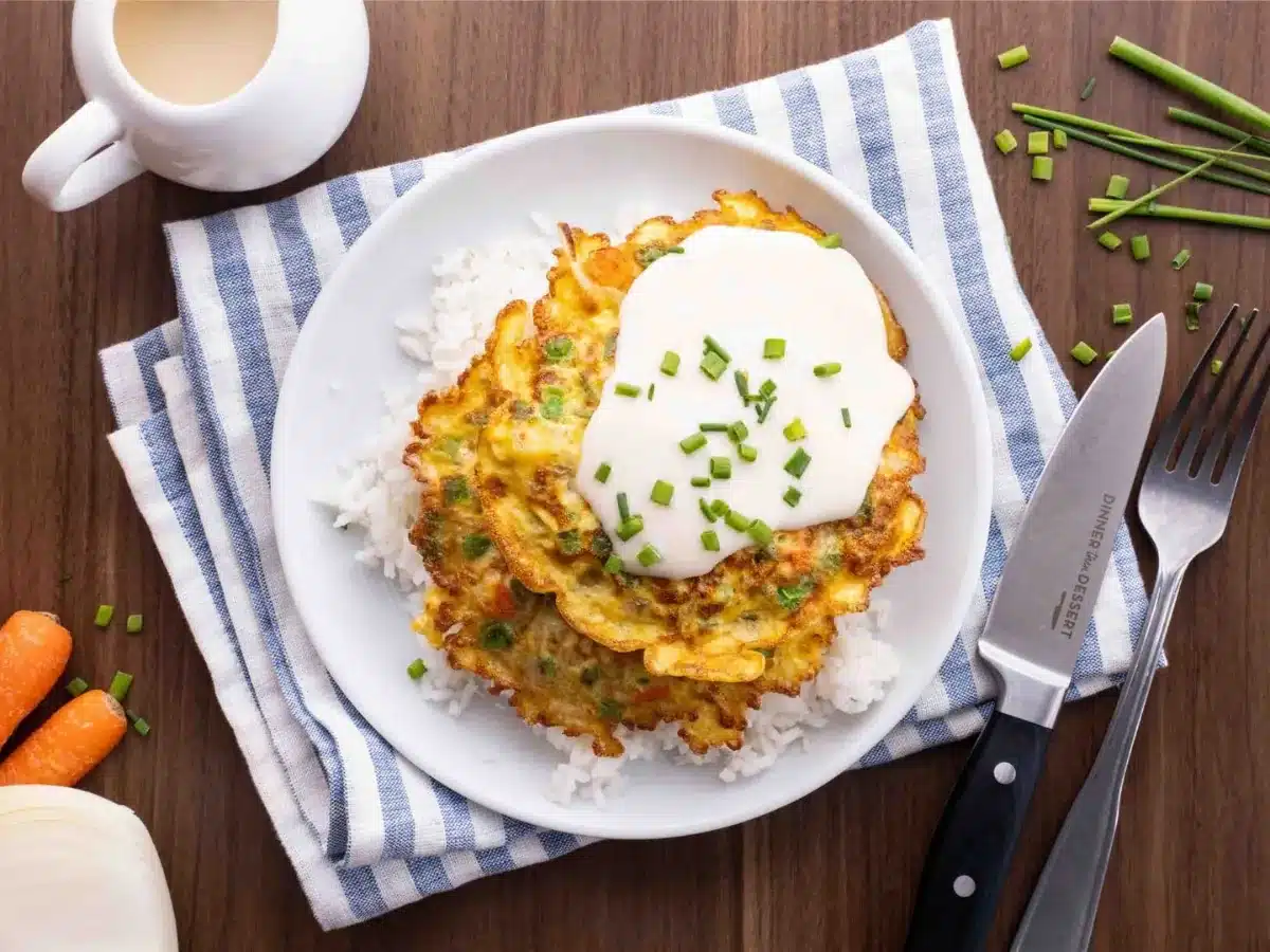 Cooked ingredients on a bed of rice ready to eat