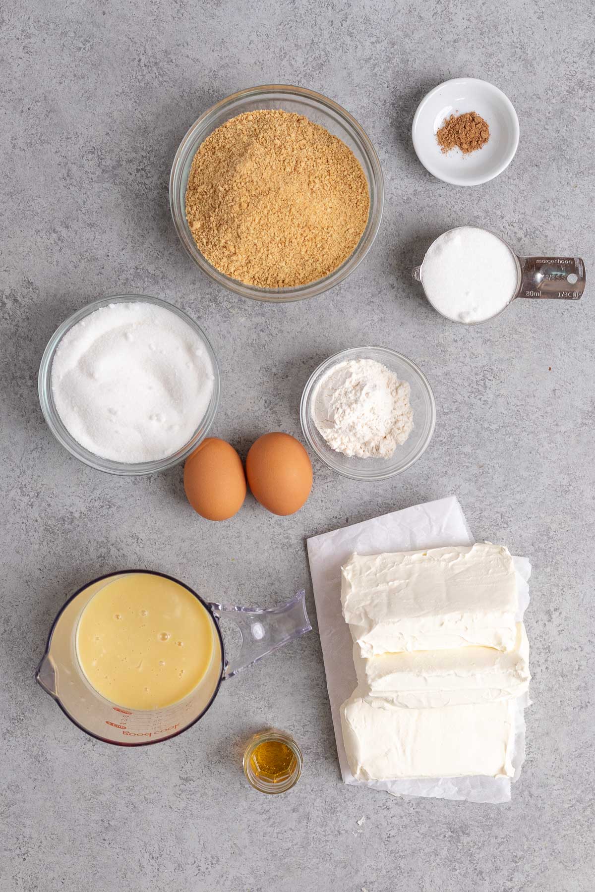 Eggnog Cheesecake ingredients in prep bowls