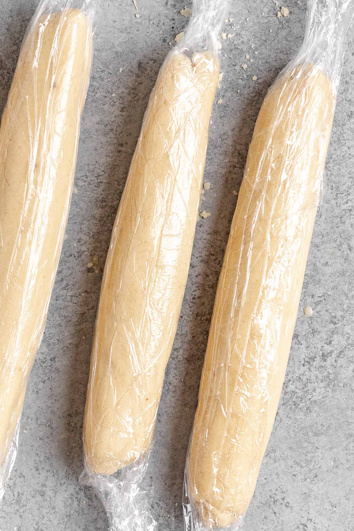 Eggnog Cookies dough in three logs wrapped in plastic