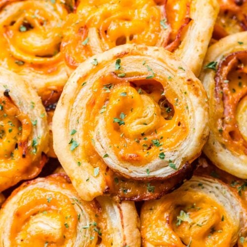 Ham and cheese pinwheels piled on a serving plate