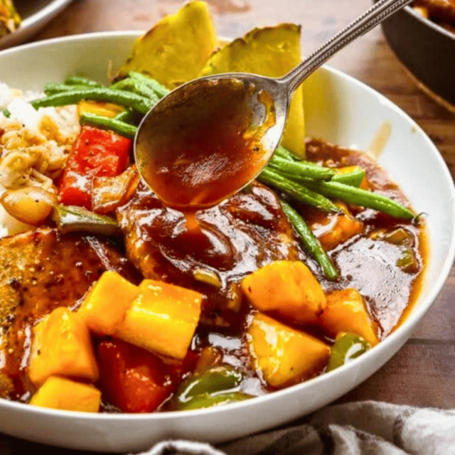 Pork chop meal in bowl with spoon