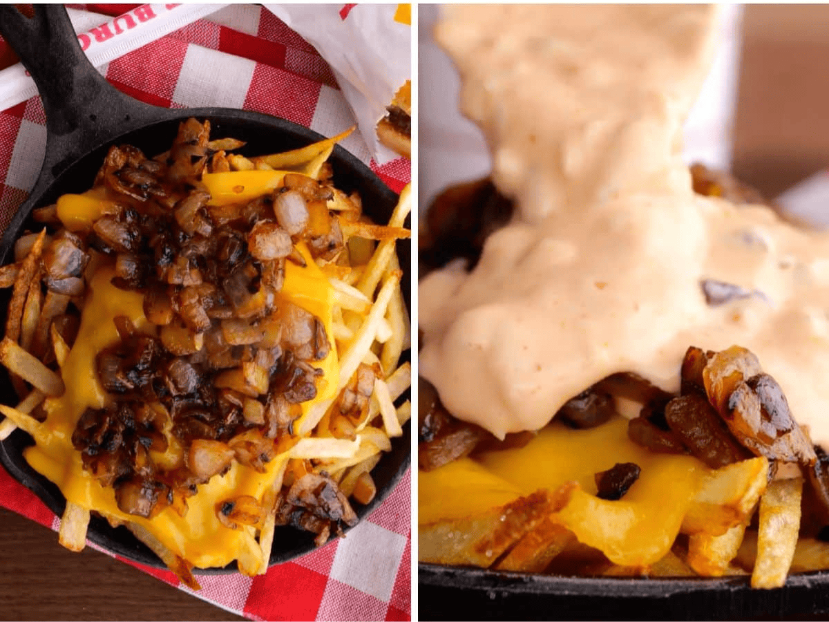 grilled onions being added on top of fries and sauce being added 