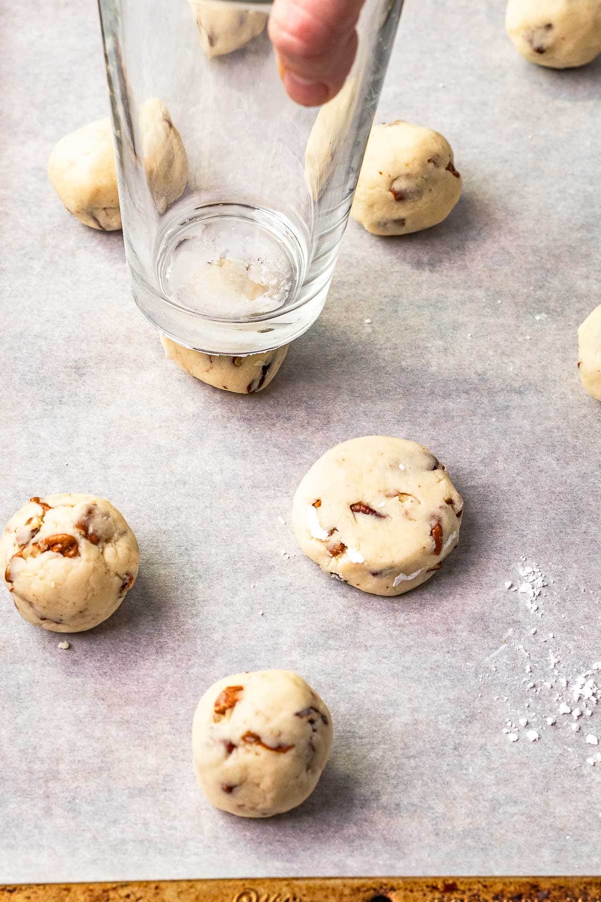 Using glass cup to smash cookie dough pic