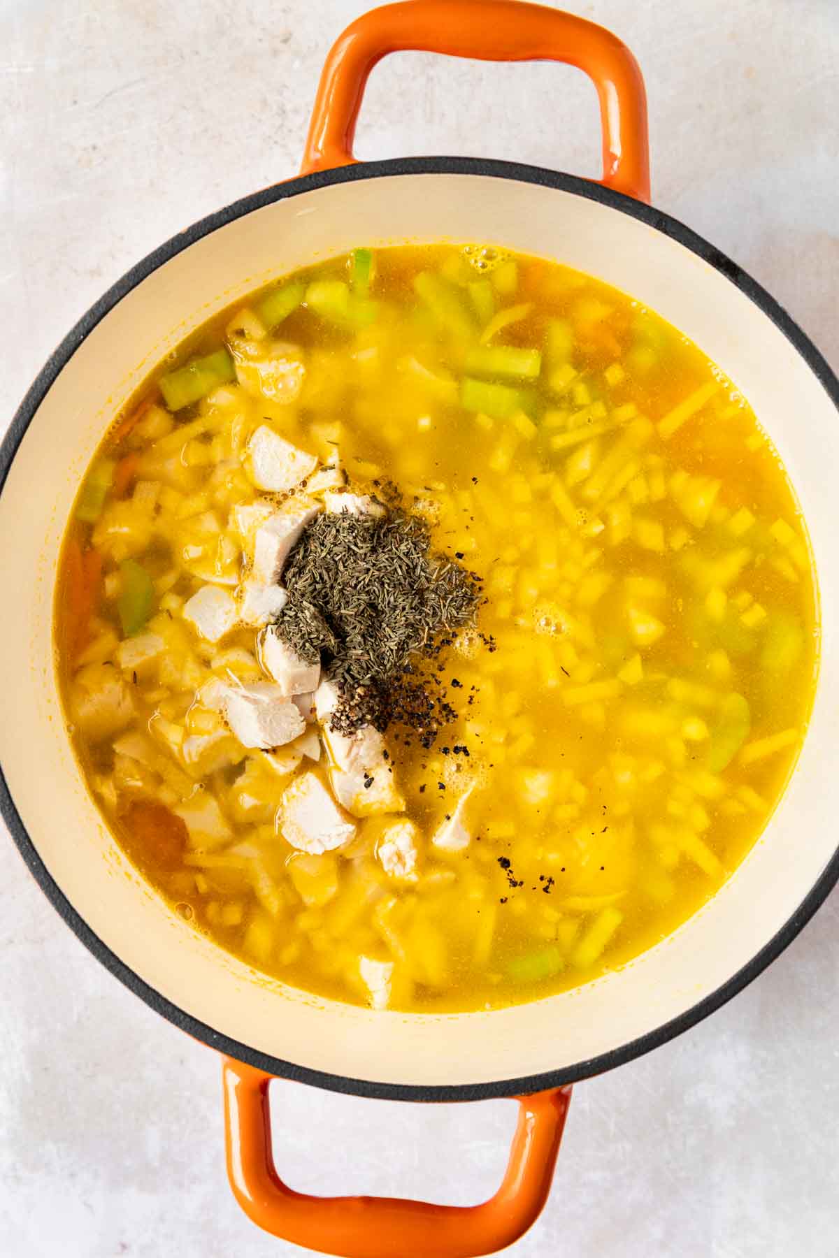 Olive Garden Chicken Gnocchi Soup ingredients in cooking pot