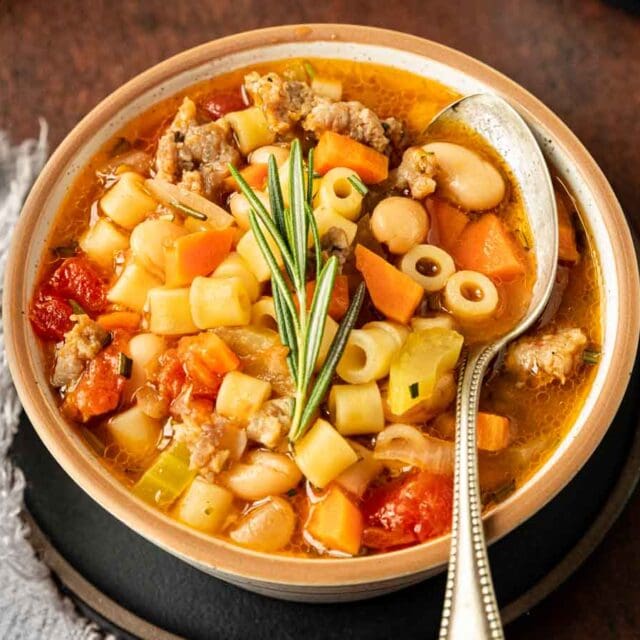 Bowl of pasta and bean soup in bowl.