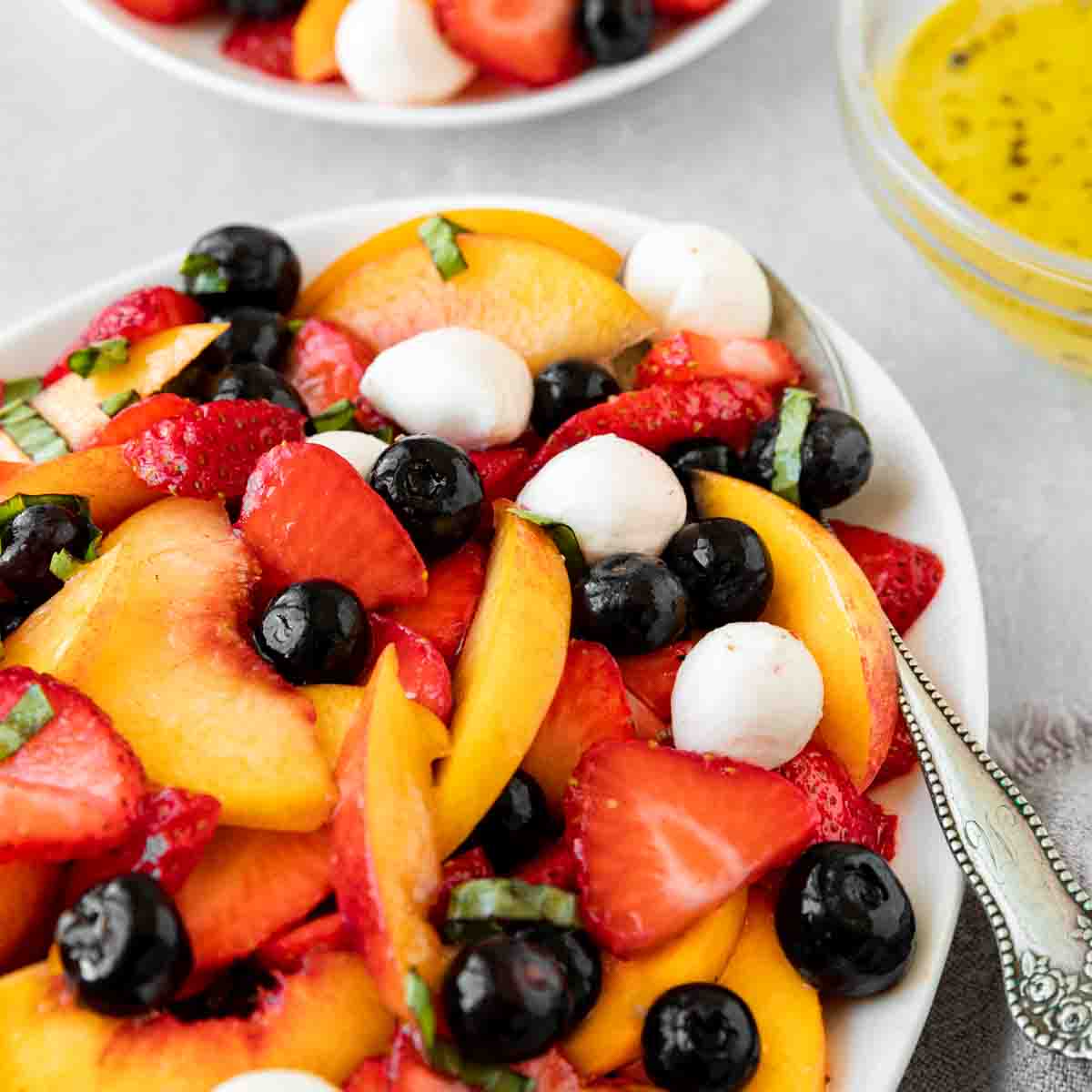 Peach Berry Caprese Salad in serving dish 1x1