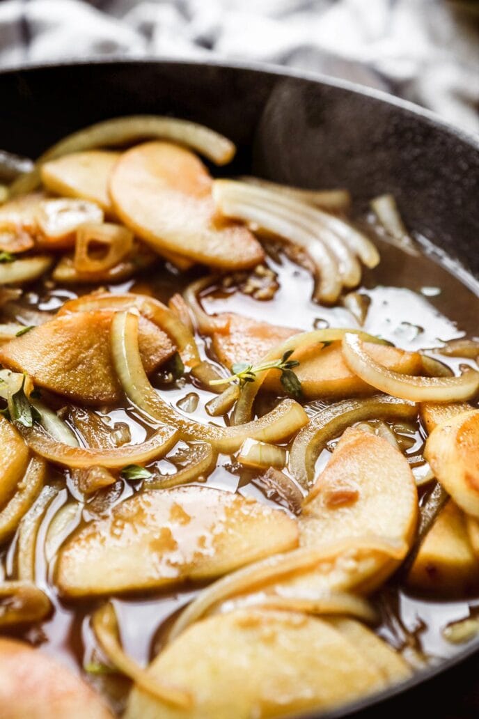 Pork Chops with Apples and Onions apples and onions cooking in skillet