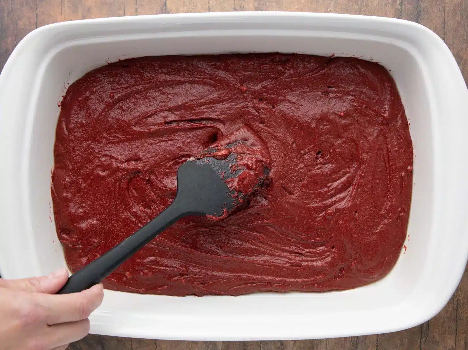 adding batter to baking dish