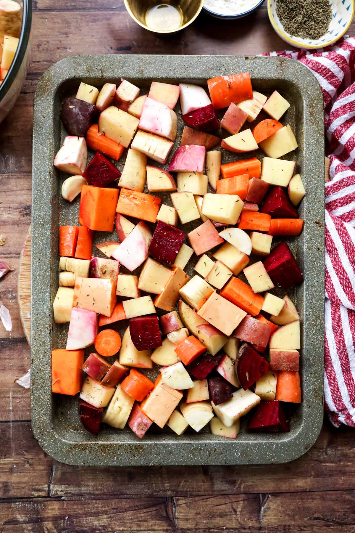 Roasted Winter Vegetables pieces in sheet pan uncooked